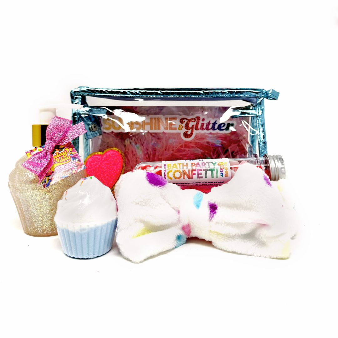 Sweet Treats Teal Bath Gift Set – includes 5 oz Birthday Everyday Aloe Glitter Cupcake, blue cupcake bath bomb, confetti soap, and confetti spa headband in a teal cosmetic tote with heart chenille sticker
Sweet Treats Teal Gift Set – glitter cupcake lotion, blue bath bomb, bubbly confetti soap, and soft confetti headband in a teal cosmetic bag with heart patch