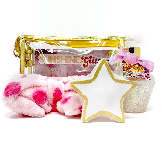 Seeing Stars Gold Gift Set – includes 5 oz Birthday Everyday aloe glitter cupcake, white and gold star bath bomb, and pink polka dot spa headband in a gold metallic cosmetic bag

Seeing Stars Gift Set – gold-themed self-care set with glitter cupcake lotion, star bath bomb, and cozy pink polka dot spa headband in a shiny gold tote

Seeing Stars Gold Gift Set – glittery lotion, white and gold star bath bomb, and soft pink spa headband in a gold metallic bag for luxe self-care