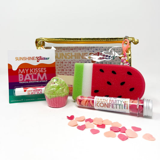 "Sunshine Glitter Watermelon Vibes Bath Set featuring a fizzy cupcake bath bomb with bracelet, organic lip balm, watermelon popsicle sponge, bath confetti, and gold gift bag with cute charm."
