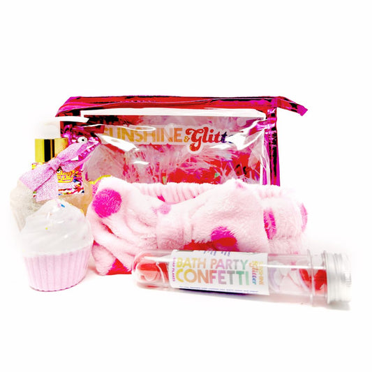 Sweet Treats Pink Bath Gift Set – includes 5 oz Birthday Everyday Aloe Glitter Cupcake, pink cupcake bath bomb, confetti soap, and pink polka dot spa headband in a pink cosmetic tote

Sweet Treats Bath Gift Set – cupcake-scented glitter aloe lotion, bath bomb, confetti soap, and spa headband in a pink cosmetic bag with rainbow chenille patch

Sweet Treats Pink Gift Set – fun bath and body gift set with glitter lotion, bath bomb, confetti soap, and soft spa headband, packed in a pink tote with rainbow sticke